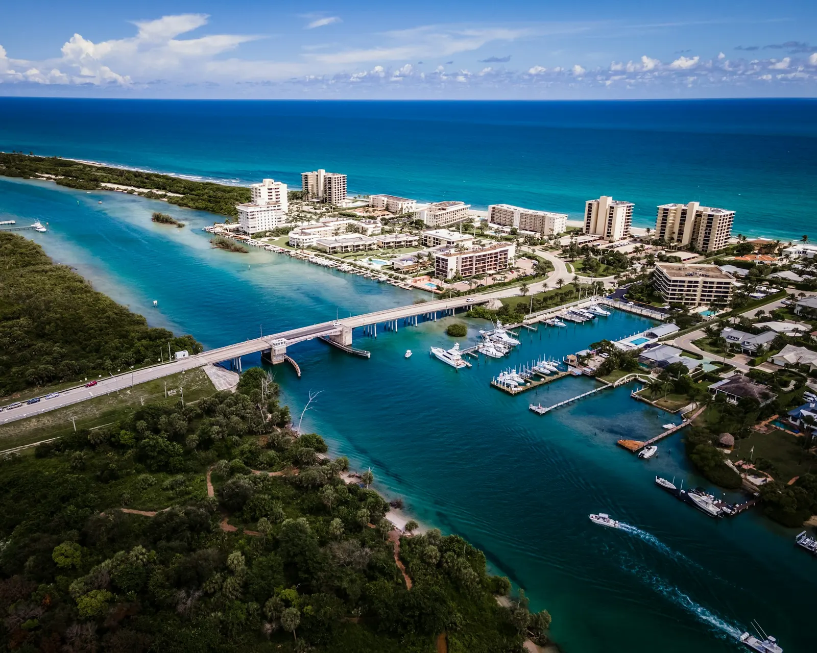Aerial view of the Jupiter Inlet area with marinas, condos and the Loxahatchee River